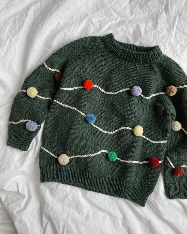 Liggebillede med rød Let's Christmas Sweater