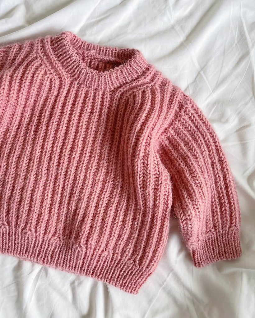 Liggebillede af lyserød September Sweater Junior